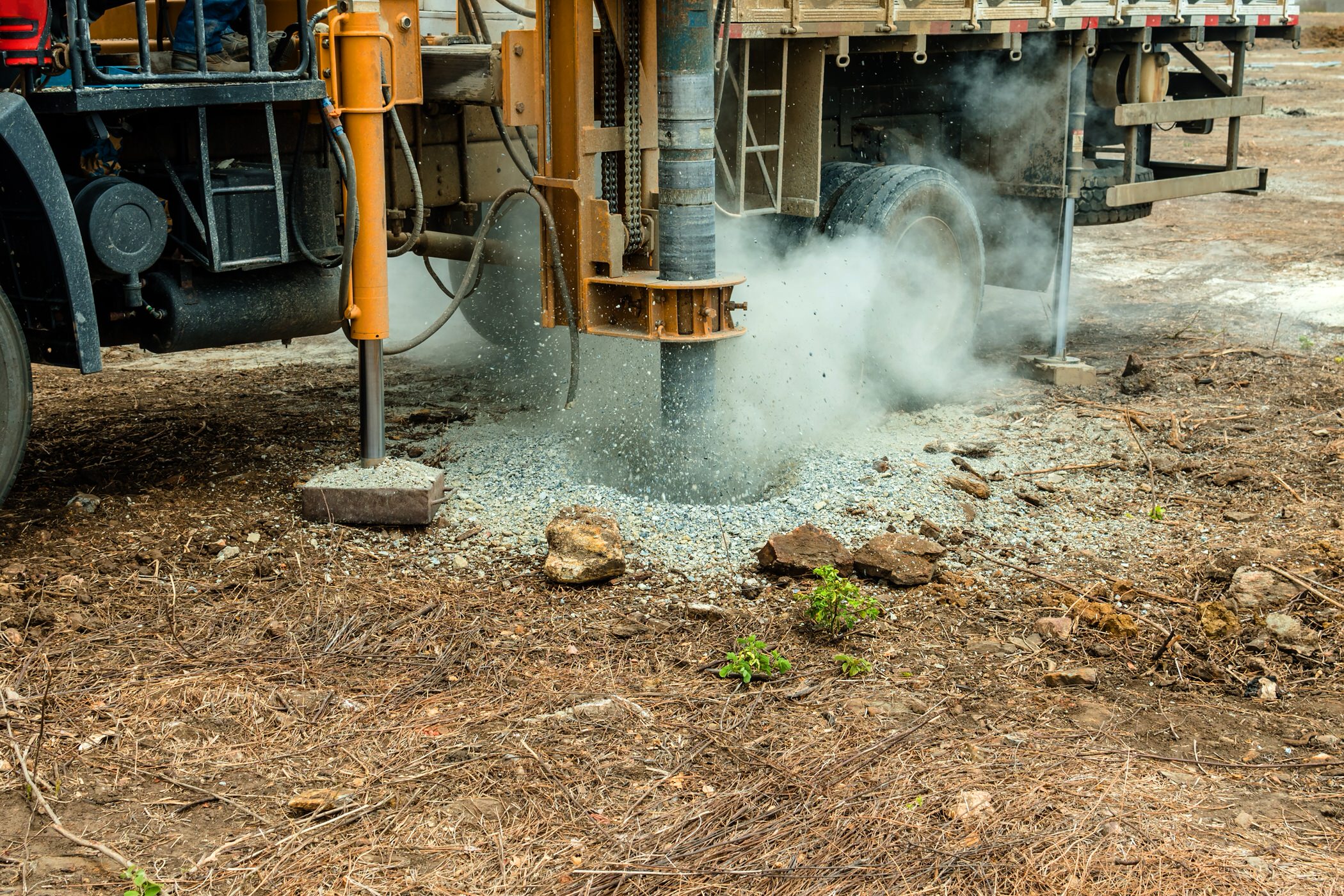 Ground improvement and soil stabilization using aggregate piers at a construction site.